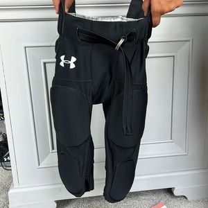 Gently used Youth Medium Under Armour football pants (black)